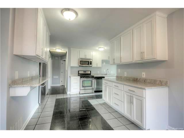 Renovated kitchen with white cabinets